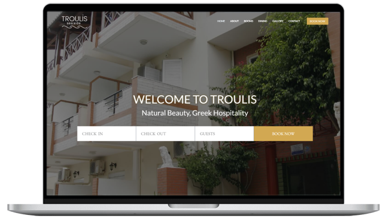 laptop device shows troulis apartments website