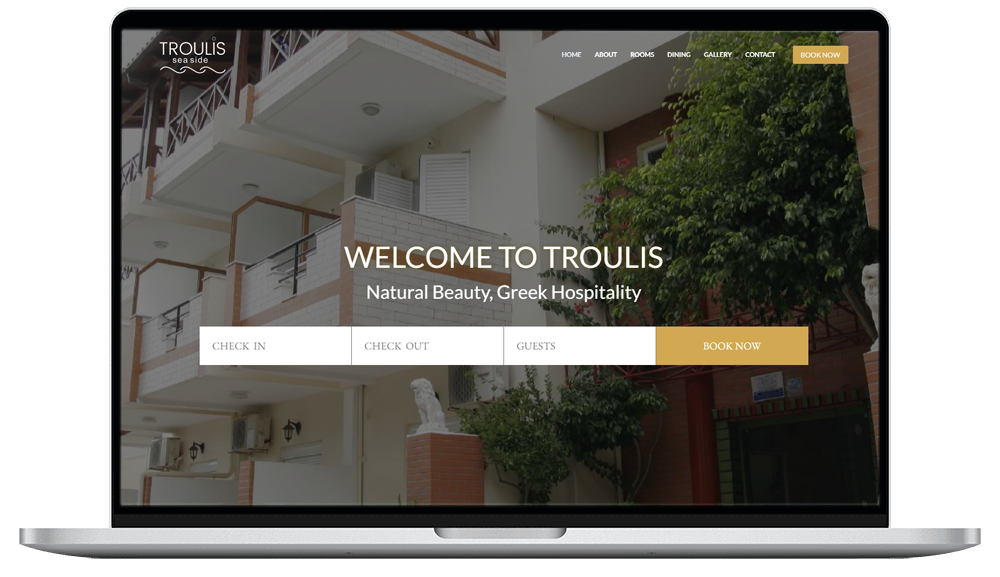 laptop device shows troulis apartments website