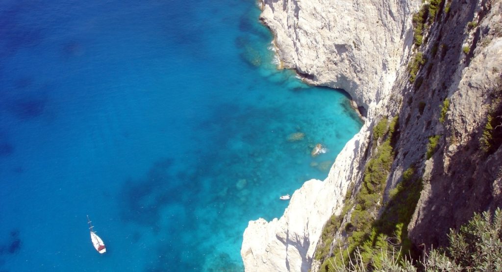 Hotel website must-haves that drive more booking (not just looks). The image shows a greek beach