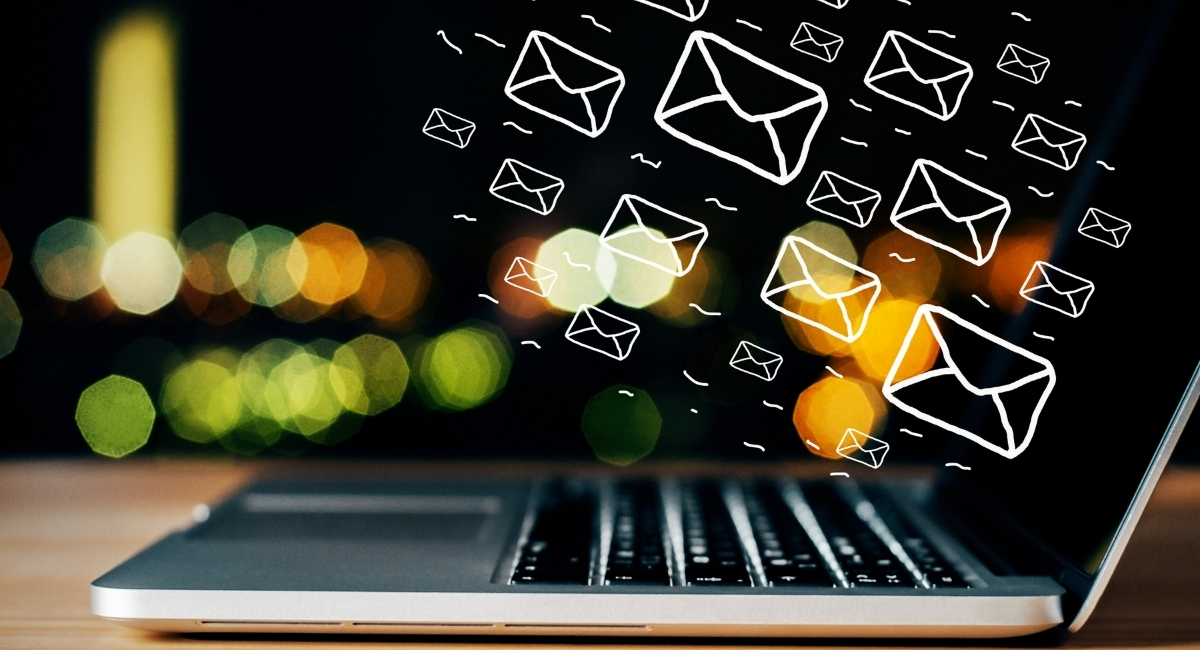 Email marketing that doesn’t go to spam Tips that work in 2025. The image shows a laptop and mails